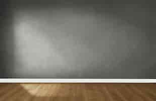Foto gratuita muro grigio in una stanza vuota con un pavimento in legno