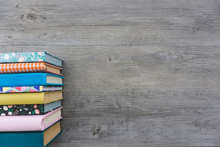 Free Photo gray wooden background with books