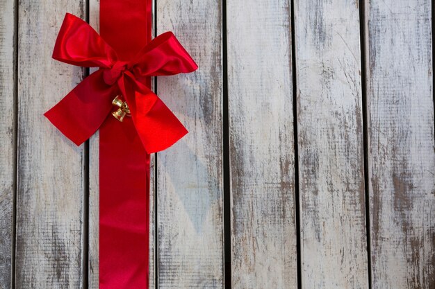 Gray wooden boards with a red tie