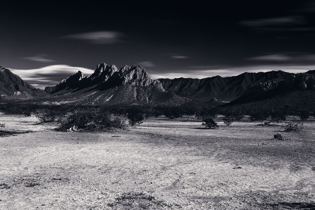 Grayscale landscape with mountains