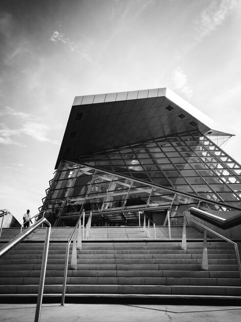 Grayscale photo of glass building