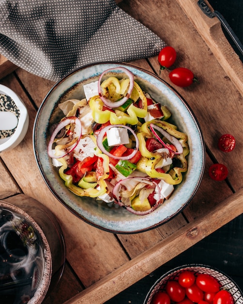 Greek salad on the table top view