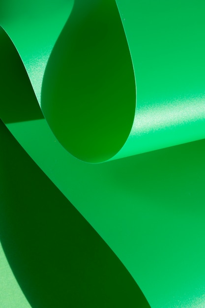 Green abstract curved monochrome paper