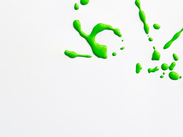 Green acrylic splash on white background