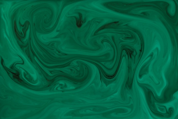 Бесплатное фото Зеленый и черный цвет постеризационного фона из переплетающихся изогнутых форм