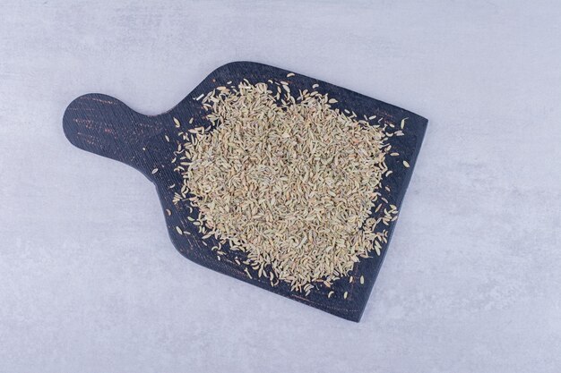 Green anise seeds isolated on concrete surface