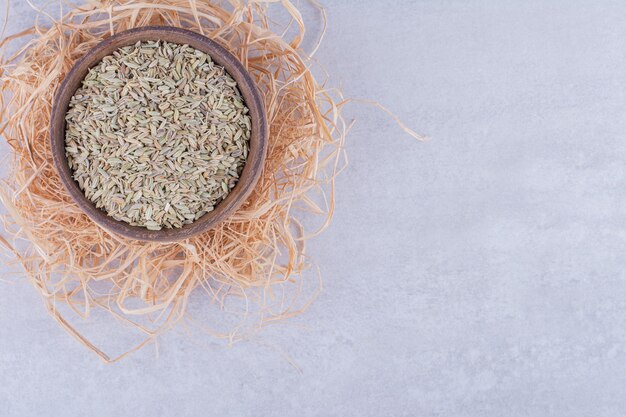 Green anise seeds isolated on concrete surface