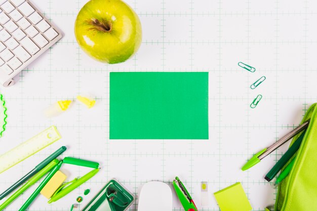 Green apple and office equipment