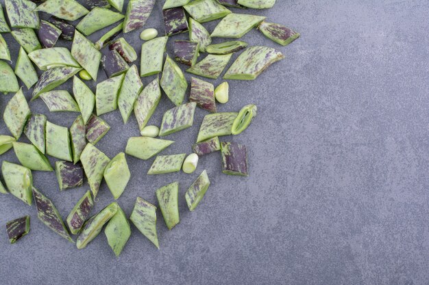 Green beans isolated on concrete background.