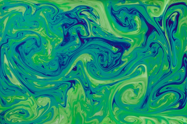 Foto gratuita liquido di vernice astratto verde e blu per lo sfondo