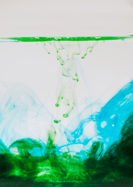 Green and blue paint in water