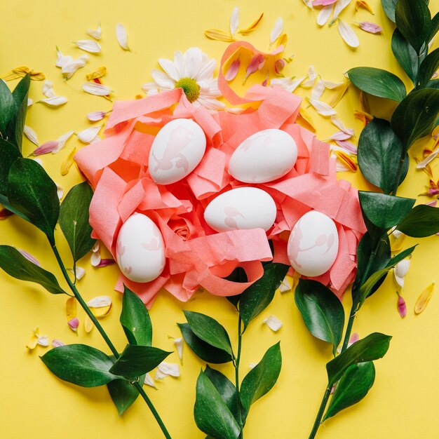 Green branches and colored eggs