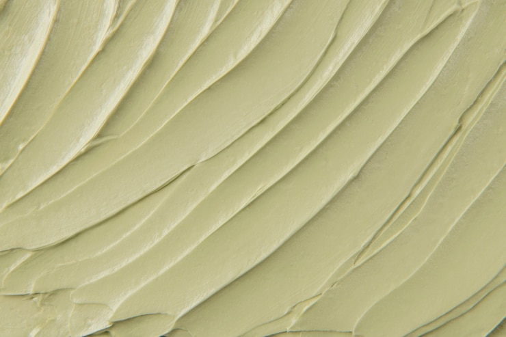Free Photo green cake frosting texture background close-up