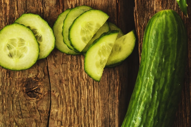 Green cucumber and slices