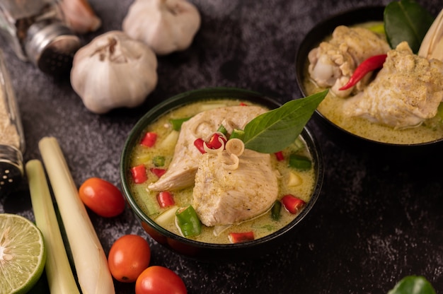 Green curry made with chicken, chili, and basil, with tomato, lime, kaffir lime leaves and garlic