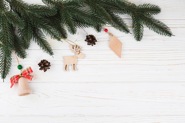 Green fir tree branches with wooden toys 