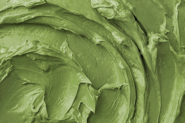 Green frosting texture background close-up