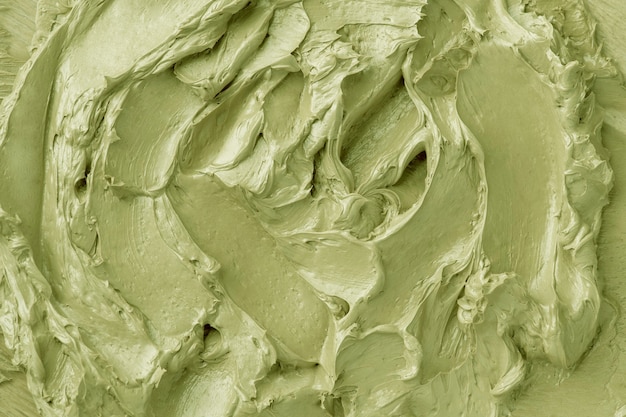 Green frosting texture background close-up