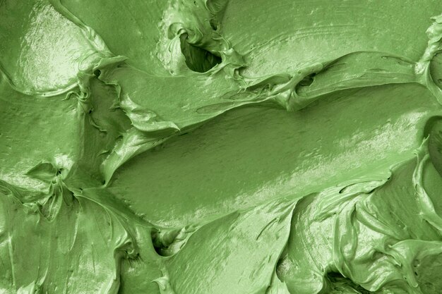 Green frosting texture background close-up