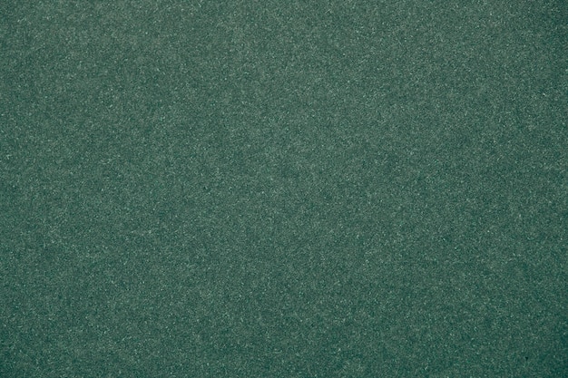 Green glitter textured paper background