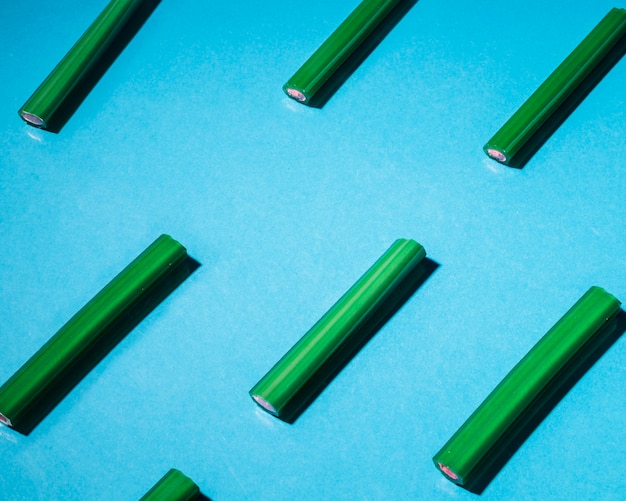 Free photo green licorice candies arranged on blue background