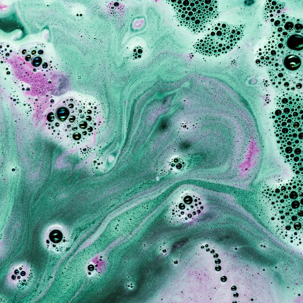 Green liquid with pink spume 