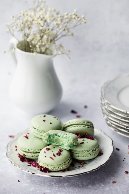 Green macaroons in plate