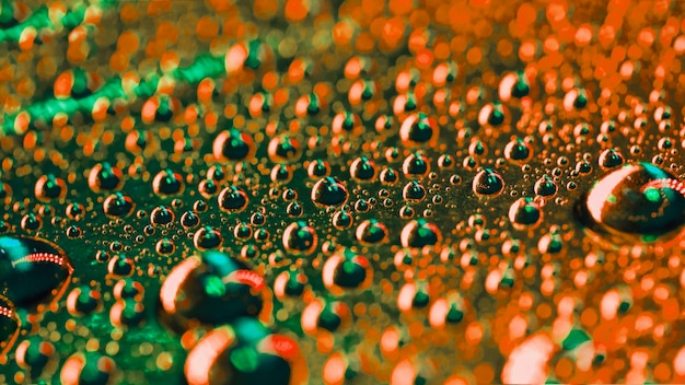 Free photo green and an orange water bubbles detail background