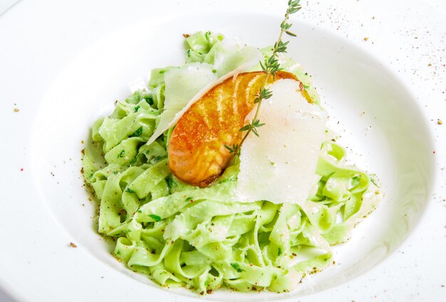 Green pasta with grilled fish