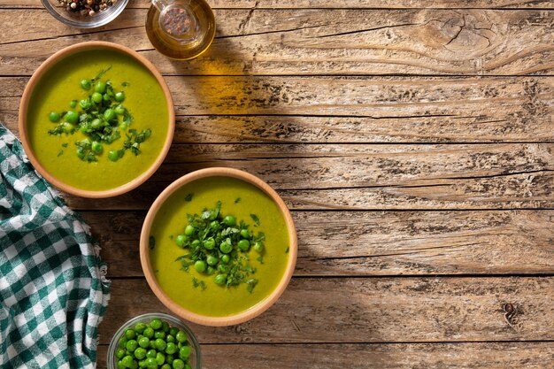 Green pea soup in a wooden bowl