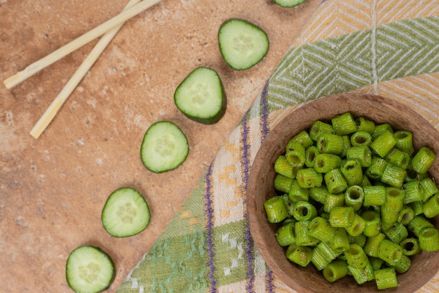 Green Penne Pasta and Cucumber Slices on Tablecloth – High Quality Free Stock Photo