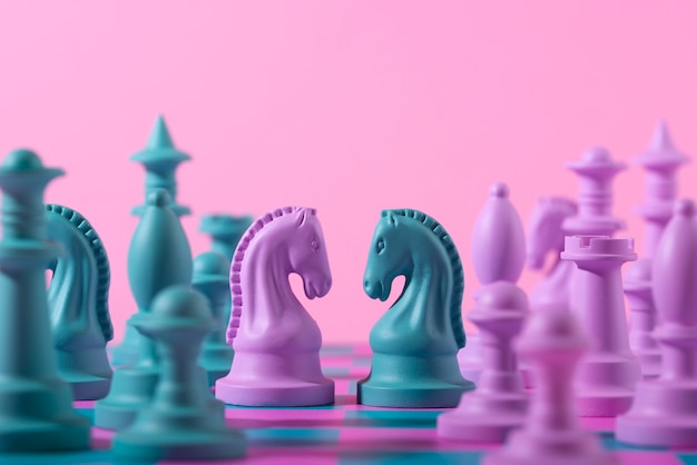 Green and pink pieces for chess with game board