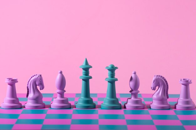 Green and pink pieces for chess with game board