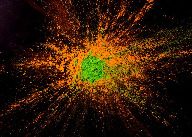green powder color on orange color over the black backdrop
