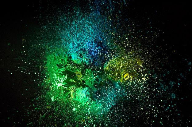 Green powder mix splash with dark background
