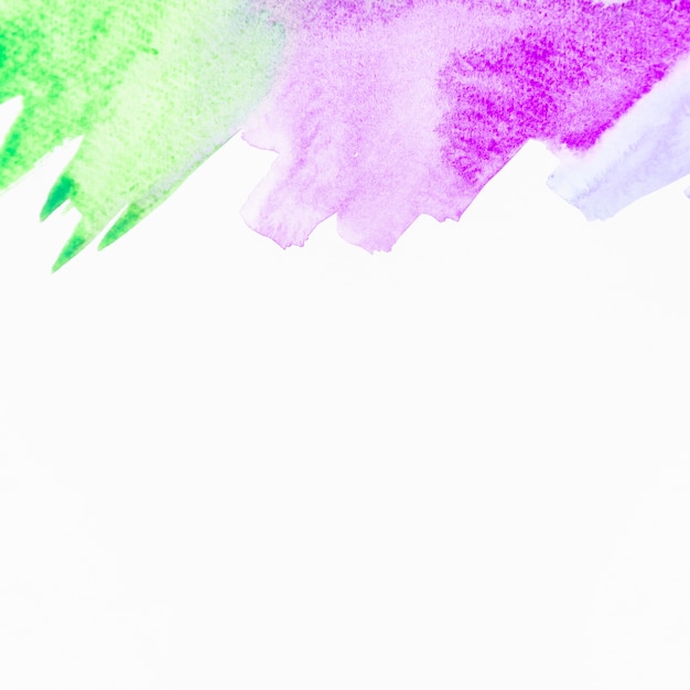 Green and purple watercolor brushstroke on white background