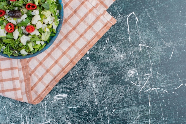 Green salad with chopped herbs and ingredients. 