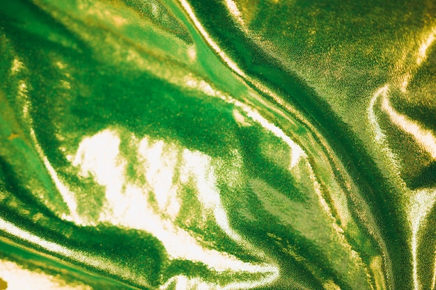 Green shiny fabric in background