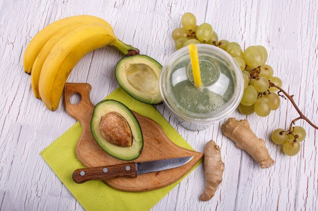 green smoothie with bananas,ginger,grape and avocado lie on the