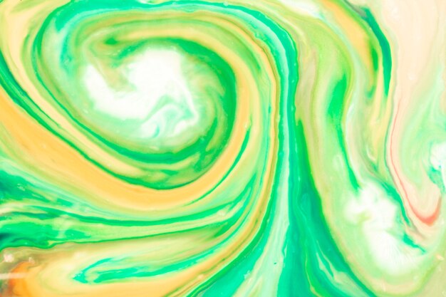 Green swirls of oily paint texture