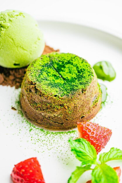 Green tea chocolate lava with ice cream and strawberry