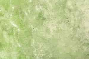Free photo green textured stucco wall background