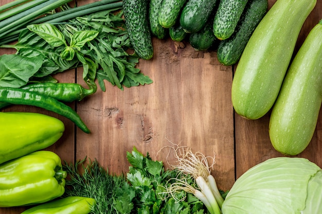 The green vegetables on wooden table