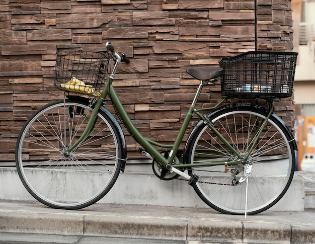 Green vintage bicycle with baskets
