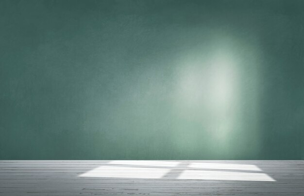 Green wall in an empty room with concrete floor