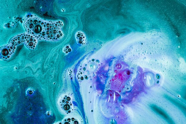 Green water with purple bath bomb