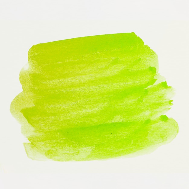 Зеленая акварель пятно мазка на белом холсте
