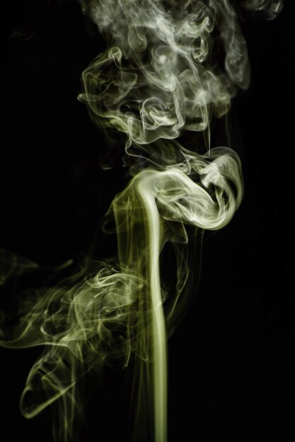 Green wavy smoke on black background