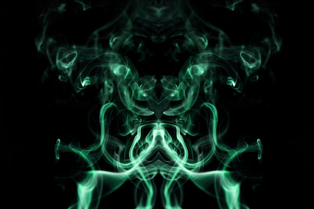Бесплатное фото Зеленый волнистый дым на черном фоне