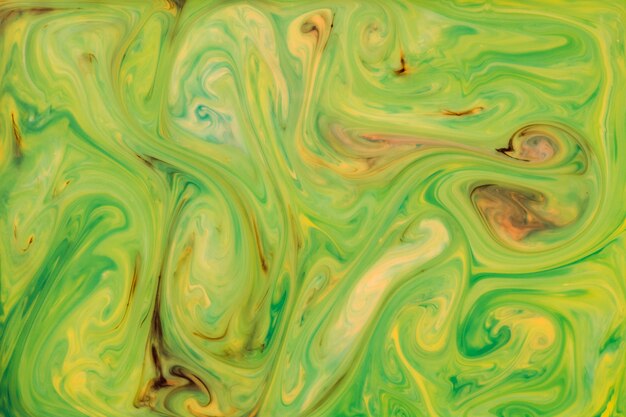 Green and yellow acrylic texture mixed paint abstract with marble pattern